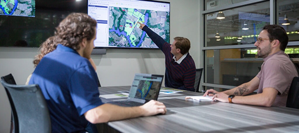 Group of Cypress Creek employees collaborating in a meeting