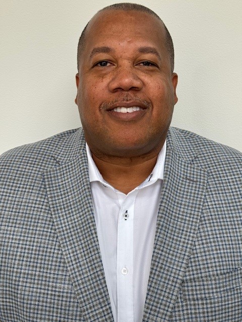 A photograph of a man in a suit